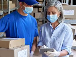 Workers prepare a health supplement order for a third party logistics service